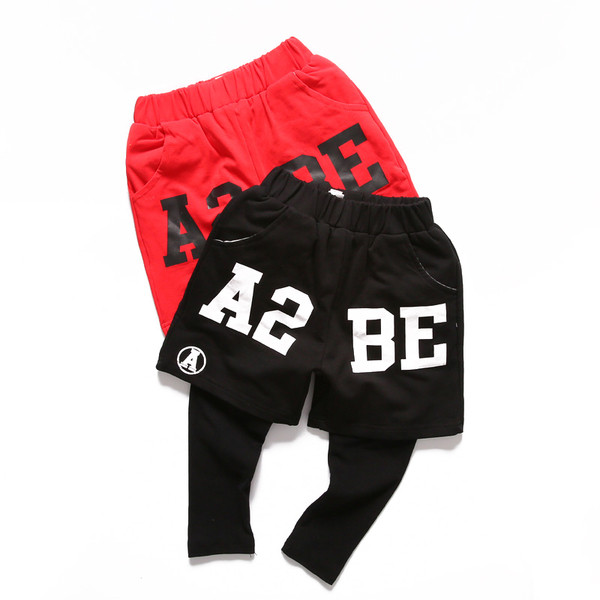 Pantaloni lungi moderni pentru copii cu imitație de pantaloni scurți în două culori cu inscripție