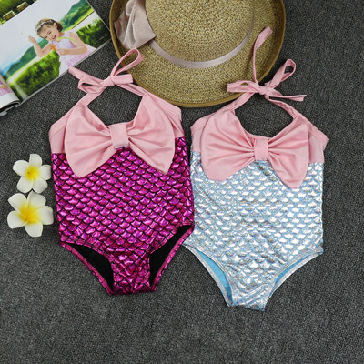 Children`s full swimsuit in two colors with a ribbon