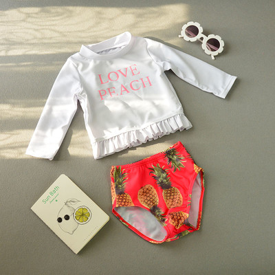 Παιδικά μοντέρνα μαγιό για κορίτσια - μπλούζα με κορδέλα και σορτς με εκτύπωση