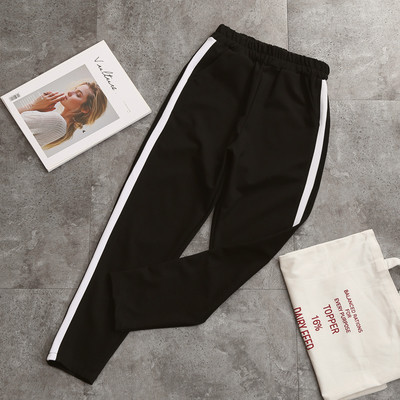 Γυναικείο μαύρο παντελόνι με λευκά και ασημένια μπορντούρα