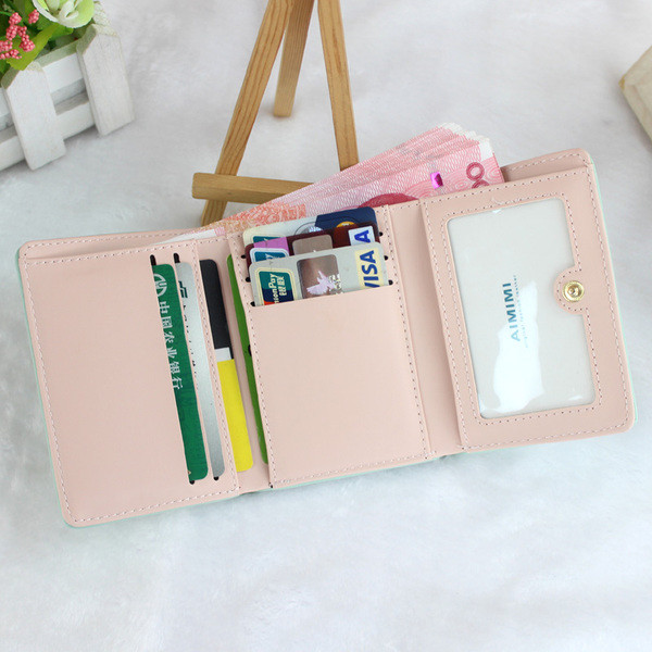 Γυναικείο πορτοφόλι με επιγραφή και φούντα σε διάφορα χρώματα