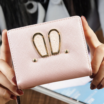 Γυναικείο μικρό πορτοφόλι σε τέσσερα χρώματα με μεταλλική διακόσμηση