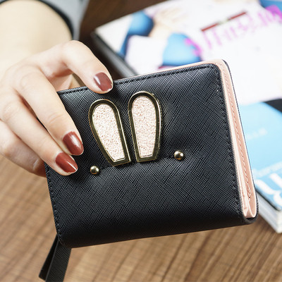 Γυναικείο μικρό πορτοφόλι σε τέσσερα χρώματα με μεταλλική διακόσμηση