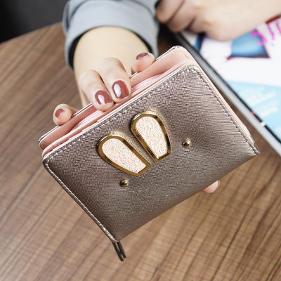 Γυναικείο μικρό πορτοφόλι σε τέσσερα χρώματα με μεταλλική διακόσμηση