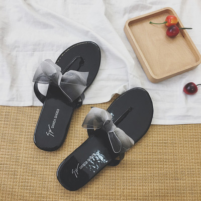 Γυναικέιες παντόφλες σε δύο χρώματα με κορδέλα