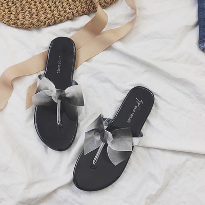 Γυναικέιες παντόφλες σε δύο χρώματα με κορδέλα