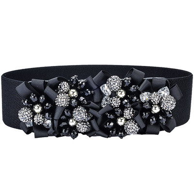 Women`s elastic belt with decorative stones and lace