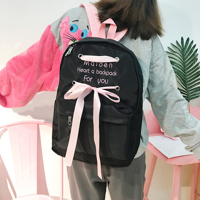 Καθημερινό γυναικείο σακίδιο σε μαύρο και ροζ με κορδέλα και επιγραφή