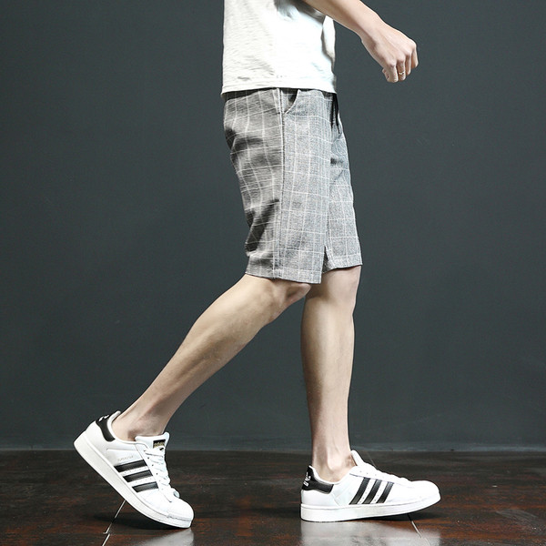 Pantaloni scurți eleganti în carouri, cu buzunare