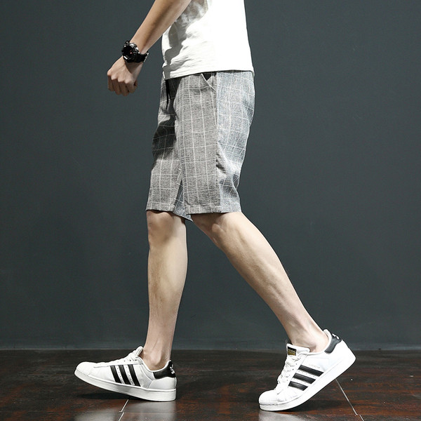 Pantaloni scurți eleganti în carouri, cu buzunare