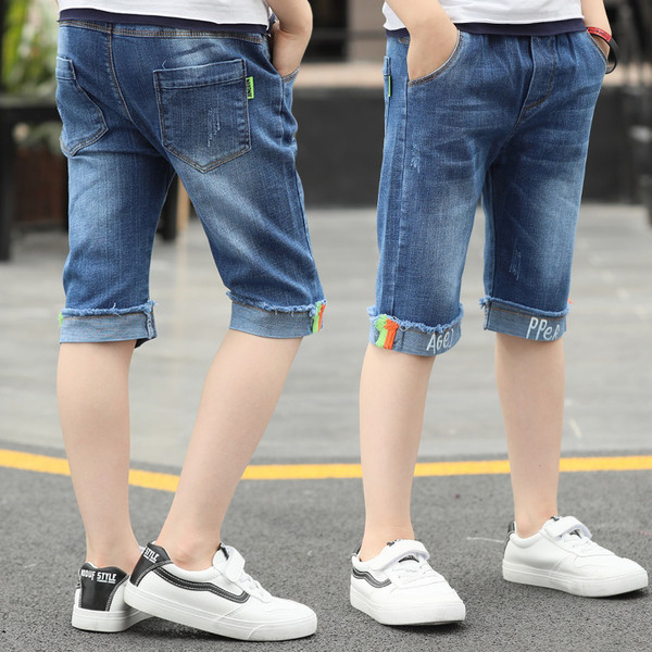 Blugi pentru copii cu elemente colorate și inscripție