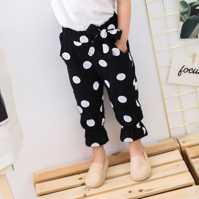 Pantaloni la modă pentru copii pentru o fată în mai multe culori cu o panglică