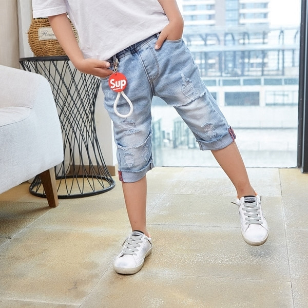 Blugi copii 7/8 cu motive rupte de culoare deschisa