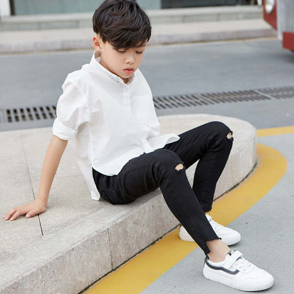 Blugi stilați pentru copii model Slim cu elemente rupte