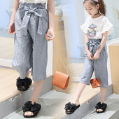 Pantaloni moderni pentru copii pentru o fată cu talie înaltă și model lat cu panglică
