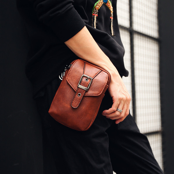 Μικρή ανδρική τσάντα σε δύο χρώματα με αφαιρούμενη μεγάλη λαβή