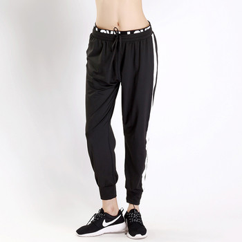 Дамски спортен панталон с широк ластик с надпис и страничен бял кант