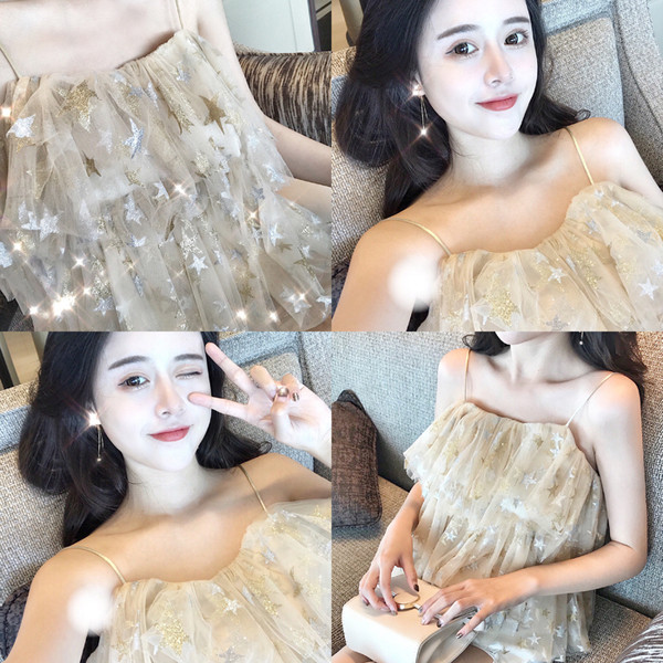 Top de dama de culoare deschisa cu elemente stralucitoare