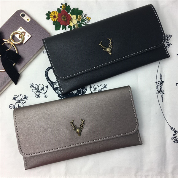 Дамски портфейл в няколко цвята с метална декорация