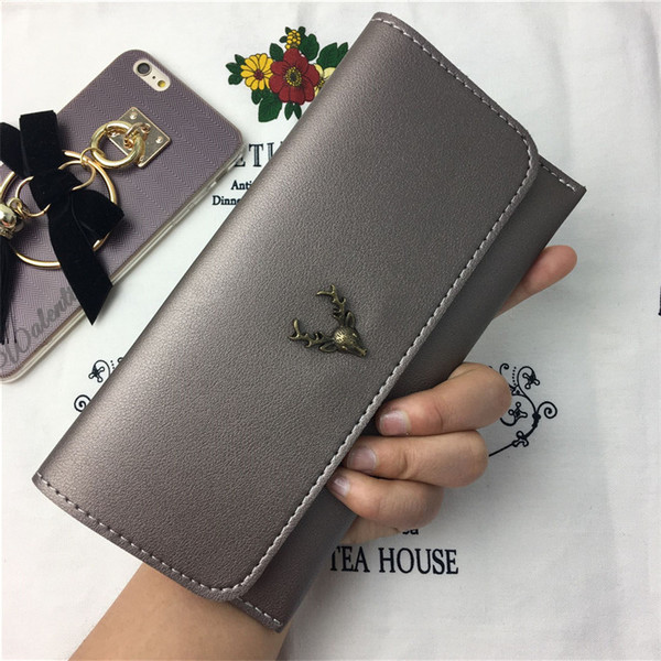 Дамски портфейл в няколко цвята с метална декорация