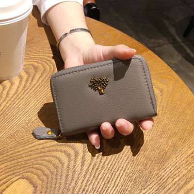 Малък дамски портфейл с цип и метална декорация