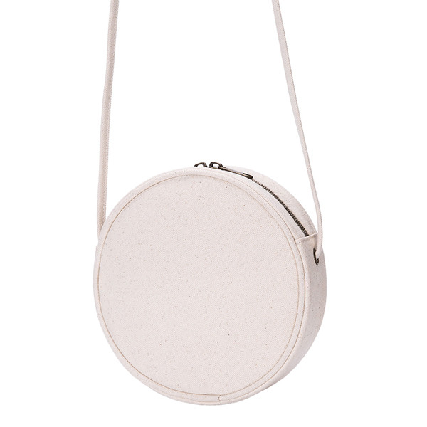 Geantă mică rotundă de damă cu o curea subțire de umăr