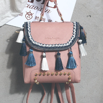 Дамска раница в четири цвята с пискюли и капси