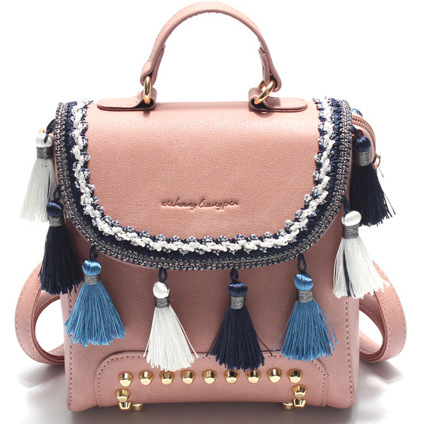 Дамска раница в четири цвята с пискюли и капси