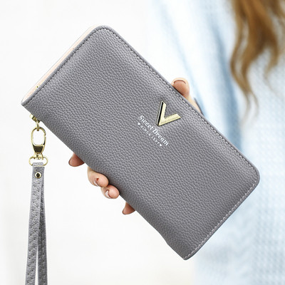 Μοντέρνο γυναικείο πορτοφόλι με φερμουάρ και μεταλλική επιγραφή σε διάφορα μοντέλα