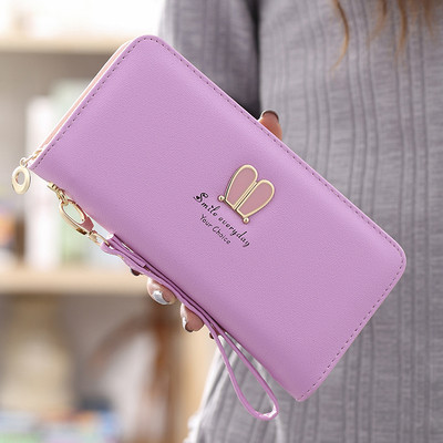 Μοντέρνο γυναικείο πορτοφόλι με φερμουάρ και μεταλλική επιγραφή σε διάφορα μοντέλα