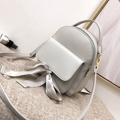 Дамска раница с външен джоб и панделка в няколко цвята