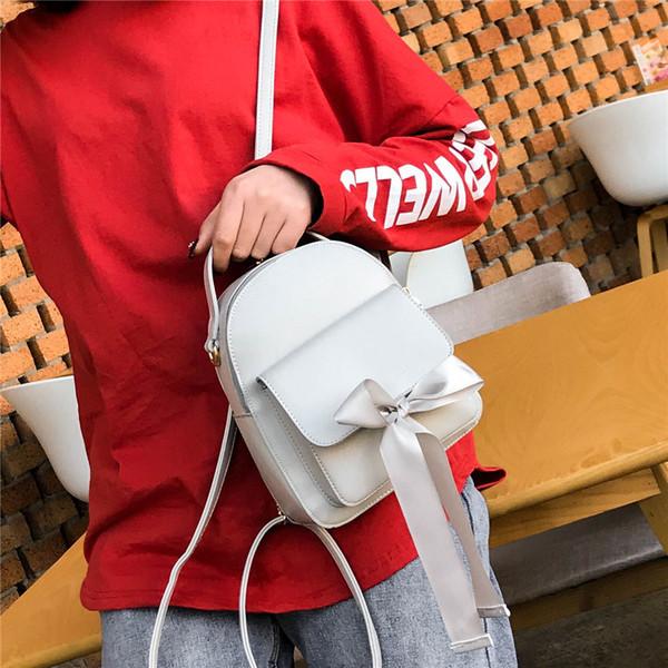 Дамска раница с външен джоб и панделка в няколко цвята