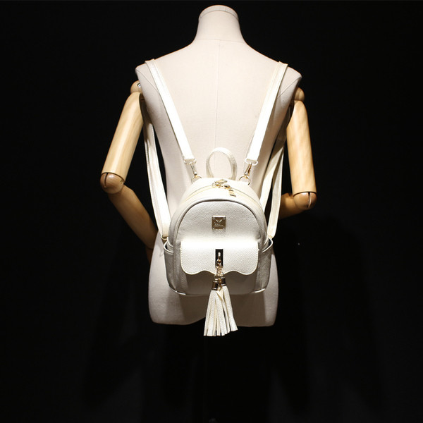 Rucsac mic de dama din piele ecologica cu ciucuri in patru culori