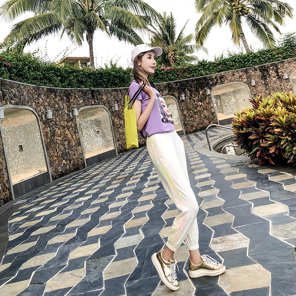 Pantaloni de dama moderni in doua culori cu un element de paiete