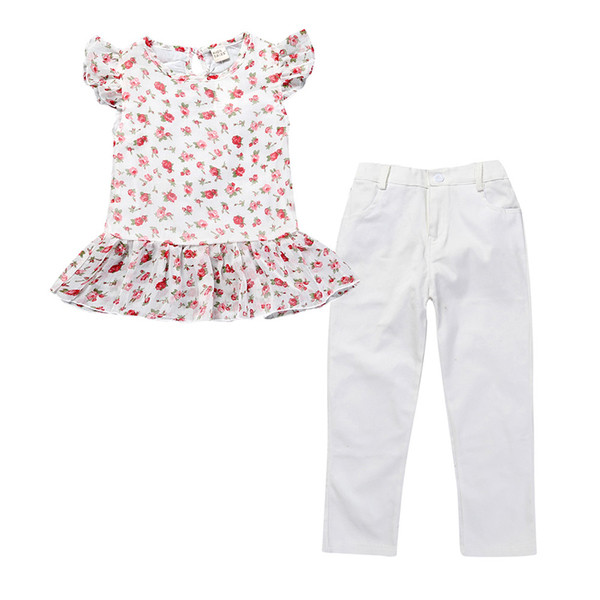 Set copii pentru fete care include pantaloni albi și o bluză cu mâneci scurte