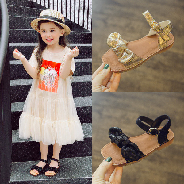 Sandale pentru copii pentru o fata cu panglica in negru si auriu