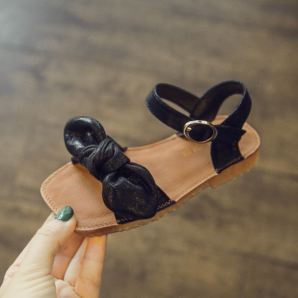 Sandale pentru copii pentru o fata cu panglica in negru si auriu