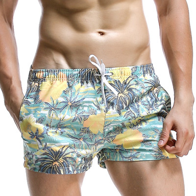 Men`s short swimsuit in floral pattern