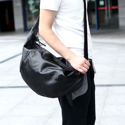 Casual men`s bag in black with a long handle
