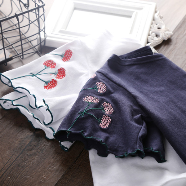 Gyermek blúz lányoknak fehér és kék virágos hímzéssel