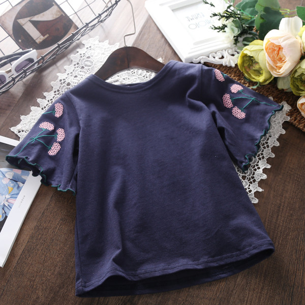 Gyermek blúz lányoknak fehér és kék virágos hímzéssel