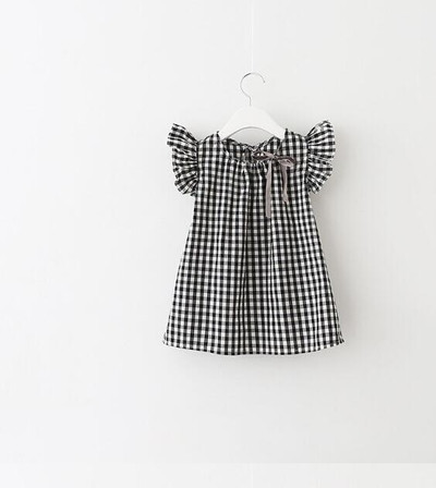 Bluză pentru copii în carouri pentru o fată cu panglică