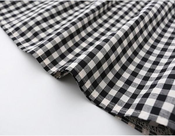 Bluză pentru copii în carouri pentru o fată cu panglică