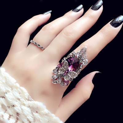 Women`s large ring with decoration and stones