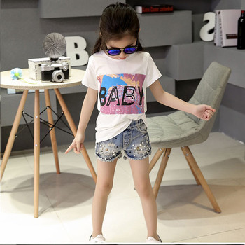 Παιδικά παντελόνια  denim με σκισμένα μοτίβα και  με μταλλική διακόσμηση 