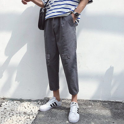 Pantaloni barbatesti cu motive rupte in mai multe culori