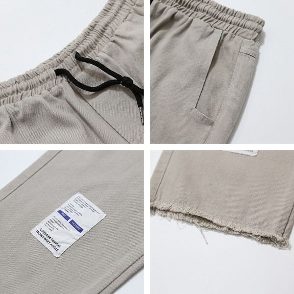 Παντελόνια ανδρικά με τυπωμένα και σκισμένα μοτίβα σε μαύρο και μπεζ χρώμα