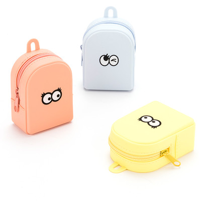 A small children`s purse with an application in three colors