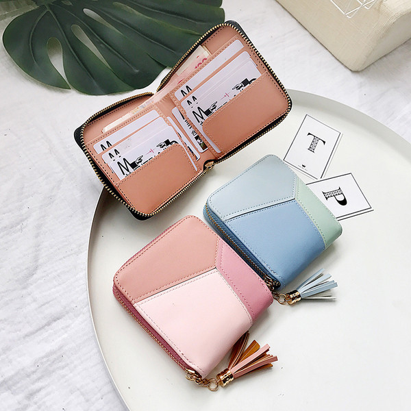 Portofel mic de dama cu ciucuri din imitatie de piele in trei culori