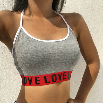 Γυναικεία αθλητική κορυφή με μεγάλη ελαστική και δίχρωμη επιγραφή